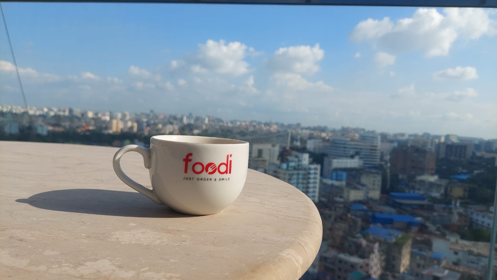 Foodi coffee mug overlooking the city